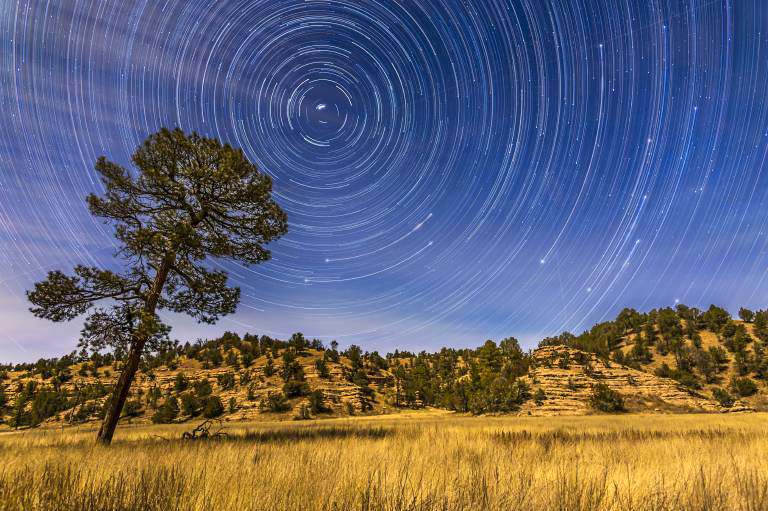 Circumpolar star trails over the moonlit Mimbres Valley near Lake Roberts in the Gila National Forest, in southwest New Mexico. Illumination is from the waxing gibbous moon. Polaris is at upper left, while the stars of the Big Dipper are rising at right, with just the BowlÖs Pointer stars visible at the start of the sequence, then rising to bring the entire Big Dipper above the horizon, with Alkaid, the end star of the handle, just clearing the ridge at right. PUBLICATIONxINxGERxSUIxAUTxONLY Copyright: AlanxDyer/StocktrekxImages ADY200220S circumpolar Star Trails Over The MoonLit Mimbres Valley Near Lake Roberts in The Gila National Forest in Southwest New Mexico Illumination IS from The waxing Crescent Moon Polaris IS AT Upper left while The Stars of The Big Dipper are Rising AT Right With Just The BowlÖs Pointer Stars Visible AT The Start of The Sequence Then Rising to bring The Entire Big Dipper above The Horizon With Alkaid The End Star of The handle Just Clearing The Ridge AT Right PUBLICATIONxINxGERxSUIxAUTxONLY Copyright AlanxDyer StocktrekxImages ADY200220S